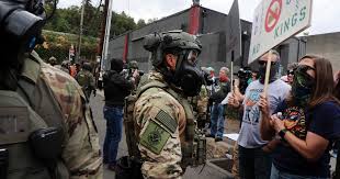 Trump Threatens to Invoke Insurrection Act as National Guard Deployed to Chicago