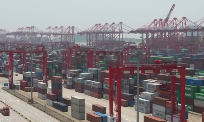 China’s Economy Slows as Factory Output and Reta